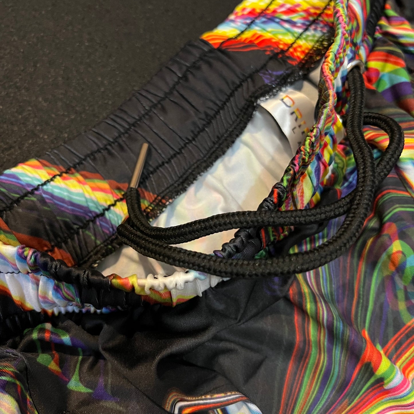 Drip Drop Labs Super Future parachute pants in lightweight fabric, featuring a relaxed fit and adjustable waistband.