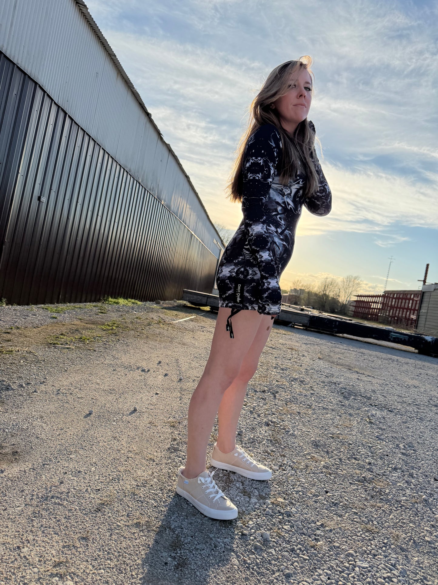 Dark galactic-themed hooded rave romper by Drip Drop Labs featuring a cosmic print and festival-ready fit.