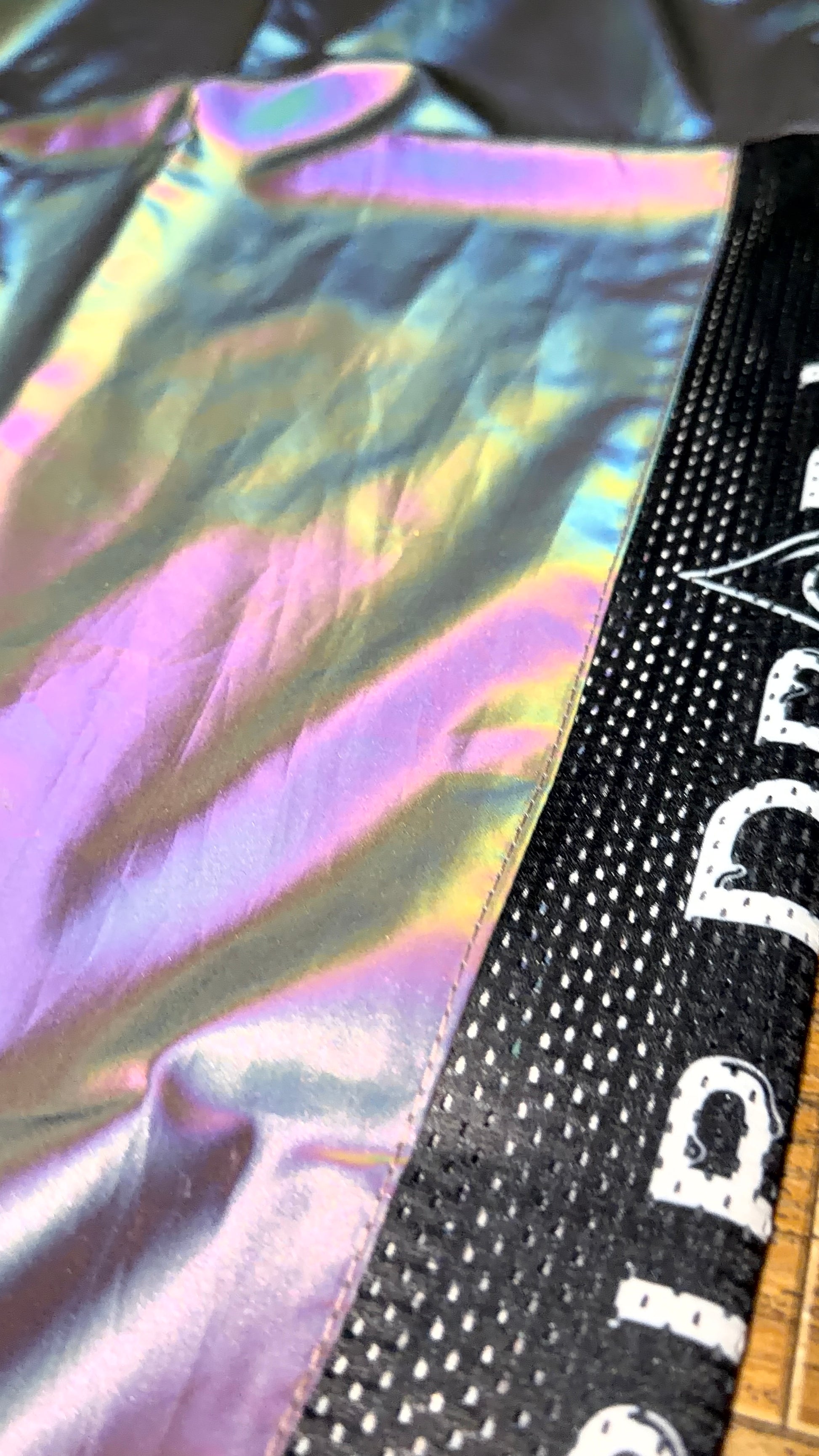Reflective parachute pants by Drip Drop Labs featuring lightweight fabric, adjustable waistband, and reflective details.