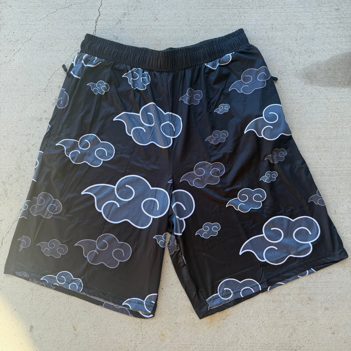 AK Drip Cloud Shorts by Drip Drop Labs, lightweight blue shorts with cloud pattern, casual fit, perfect for summer wear.