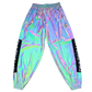 Reflective parachute pants by Drip Drop Labs featuring shiny fabric, loose fit, and adjustable waistband for a modern streetwear look.