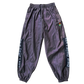 Reflective parachute pants by Drip Drop Labs featuring lightweight fabric, adjustable waistband, and reflective detailing.