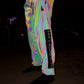 Reflective parachute pants by Drip Drop Labs featuring shiny, lightweight fabric and relaxed fit for stylish urban wear.
