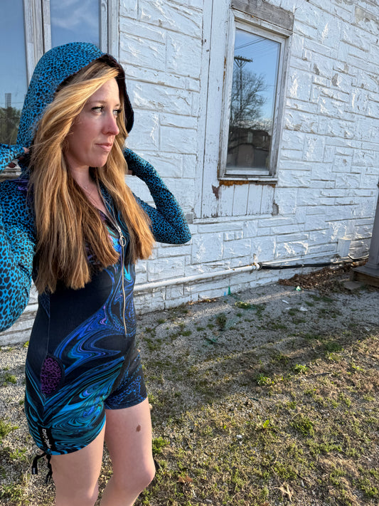 Drip Drop Labs Glitch Instinct Hooded Rave Romper with cyber animal print, featuring a futuristic design and festival-ready fit.