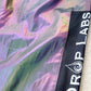 Reflective parachute pants by Drip Drop Labs featuring shiny fabric and adjustable drawstring waist for a stylish, functional look.