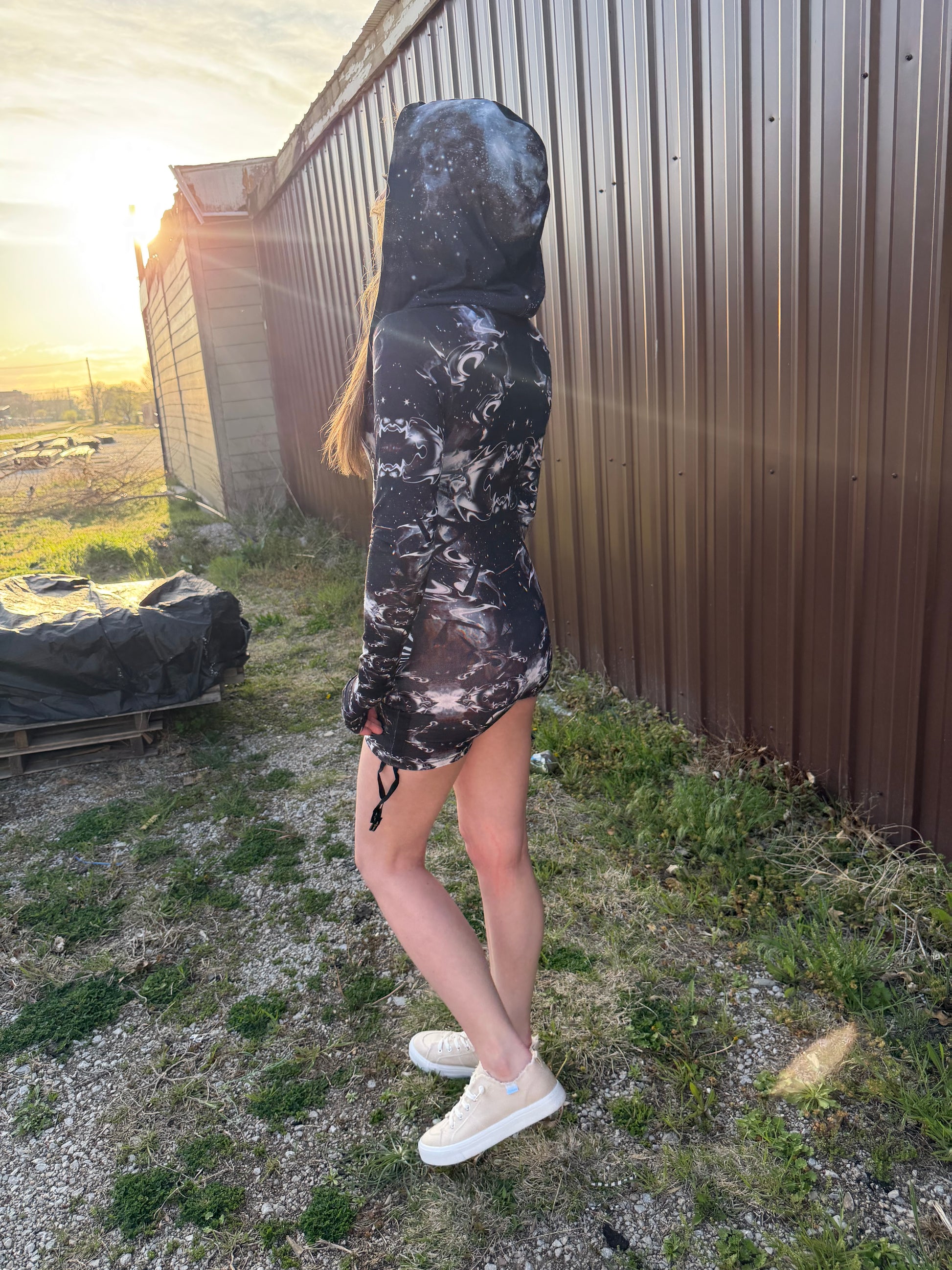 Dark galactic hooded rave romper by Drip Drop Labs featuring a celestial starry print and comfortable festival fit.