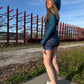 Bright neon cyber animal rave romper by Drip Drop Labs featuring a hood, bold patterns, and a futuristic festival style.