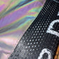 Reflective Drip Drop Labs parachute pants with shiny, metallic fabric and elastic waistband, designed for a stylish, sporty look.