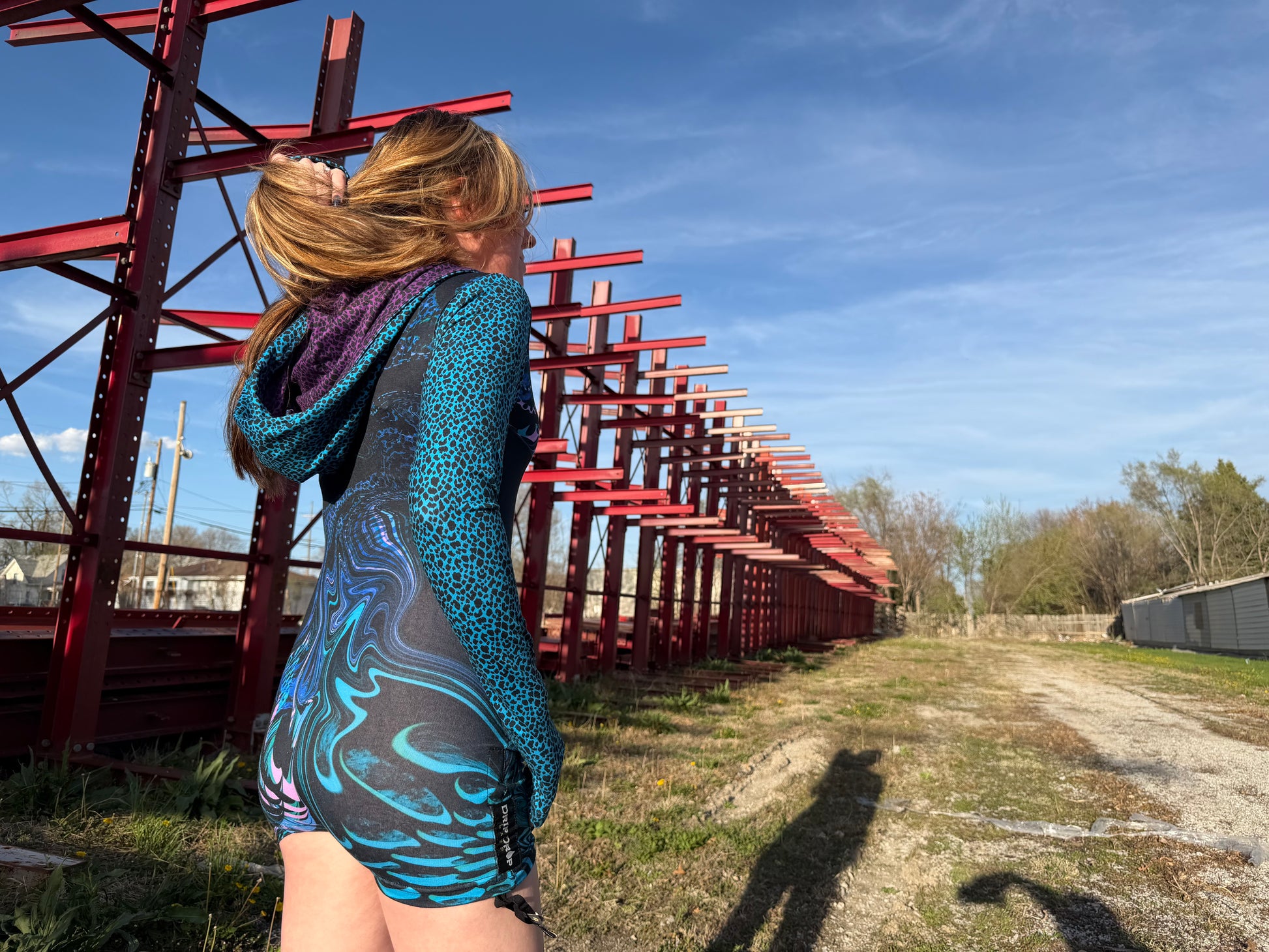 Drip Drop Labs Glitch Instinct Hooded Rave Romper with cyber animal design, featuring a hood and vibrant festival-inspired details.
