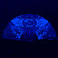 Glowing fan with intricate space patterns on a black background by drip drop labs