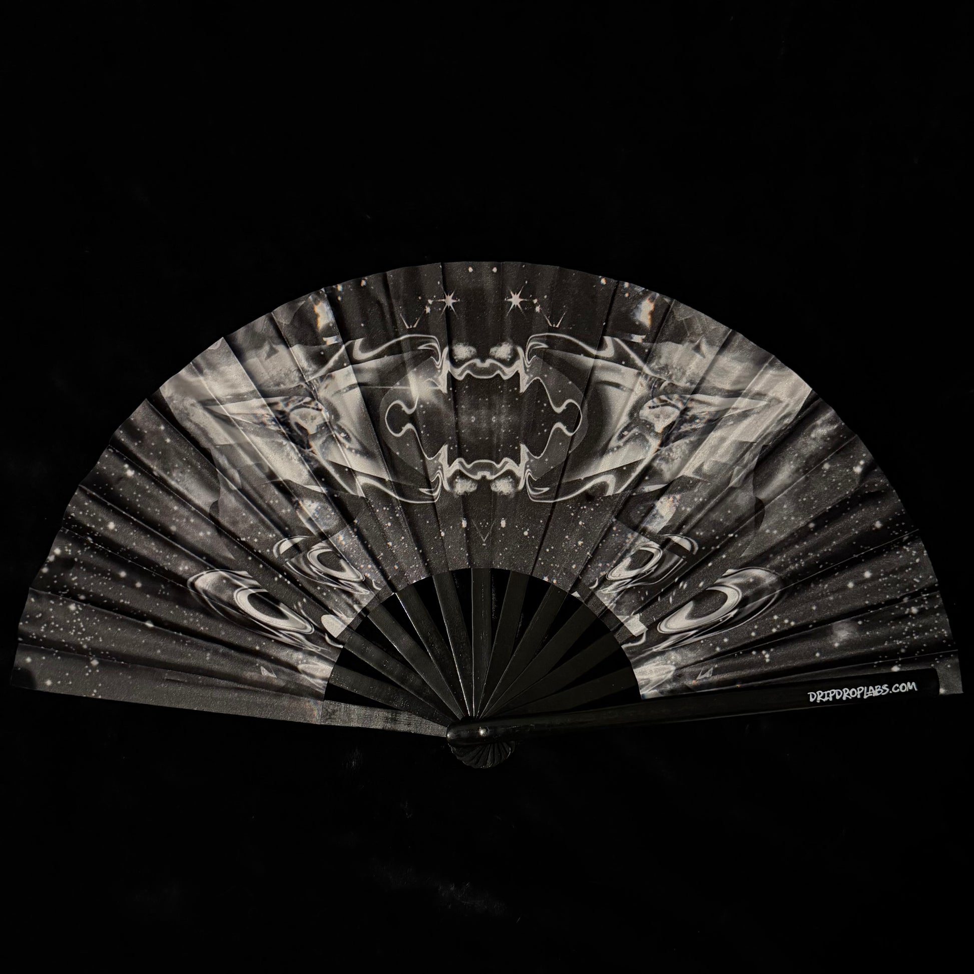 Black and white fan with abstract design on a black background