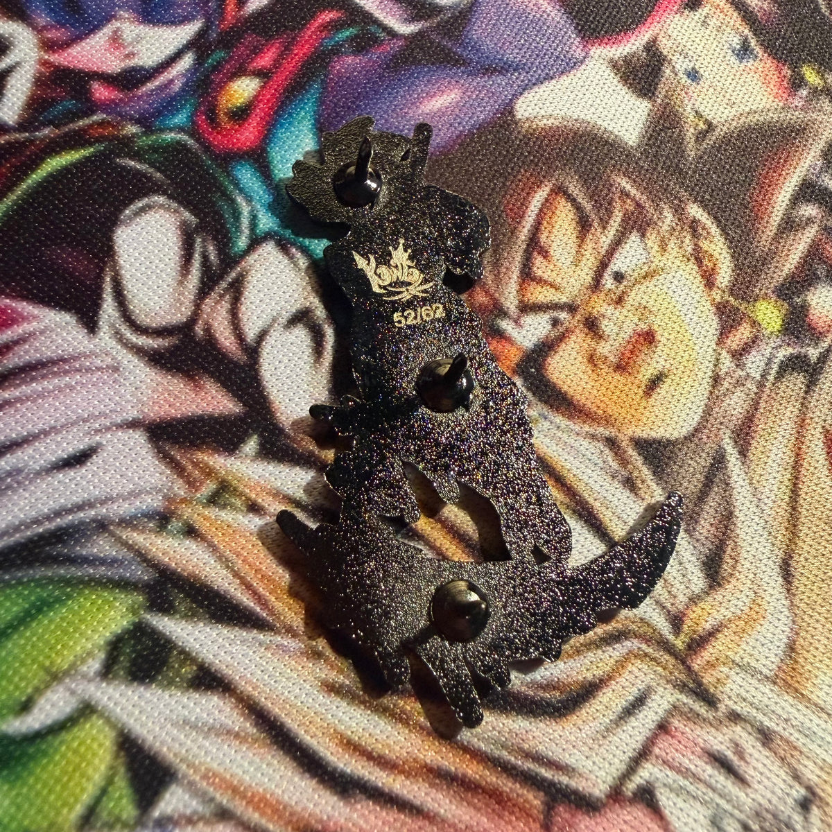 BlackDrip Reaper enamel pin by Drip Drop Labs featuring a black and silver reaper design on a pin backing.