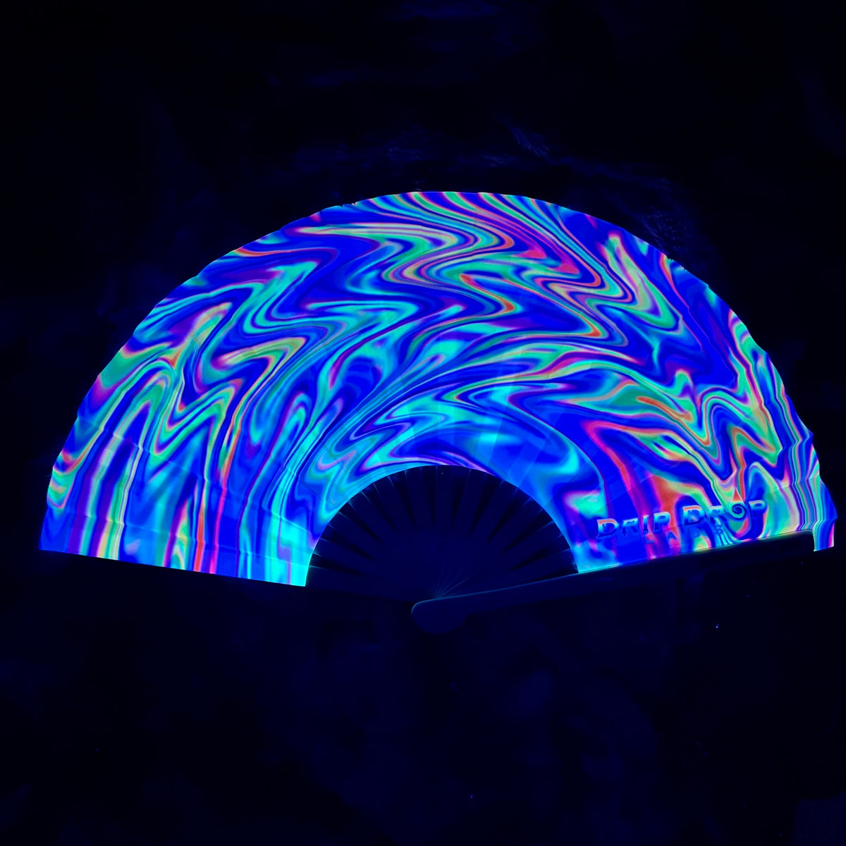 Candy Swirl Glow Fan by Drip Drop Labs featuring vibrant, colorful swirl design and glowing fan blades for a fun, eye-catching look.
