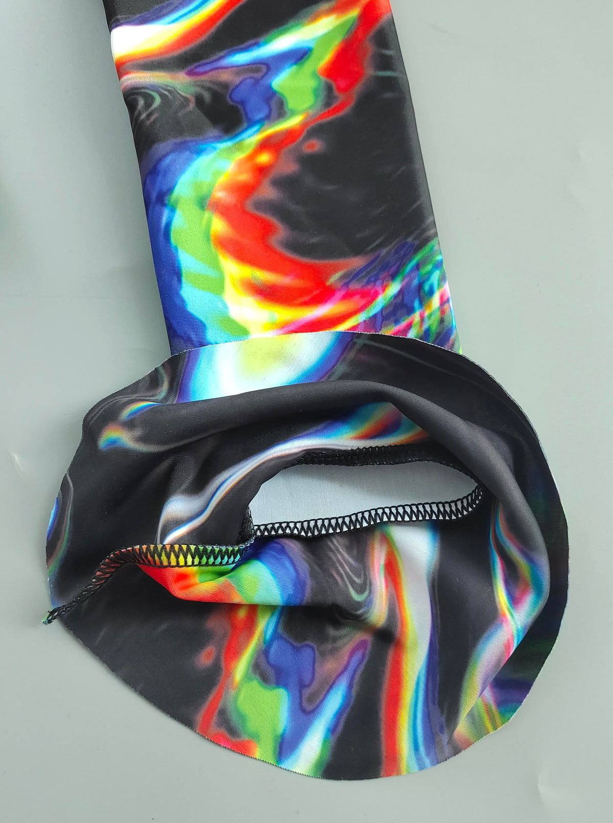 Drip Drop Labs Chromatic Seduction full-fit bathing suit with vibrant, colorful pattern and sleek design.