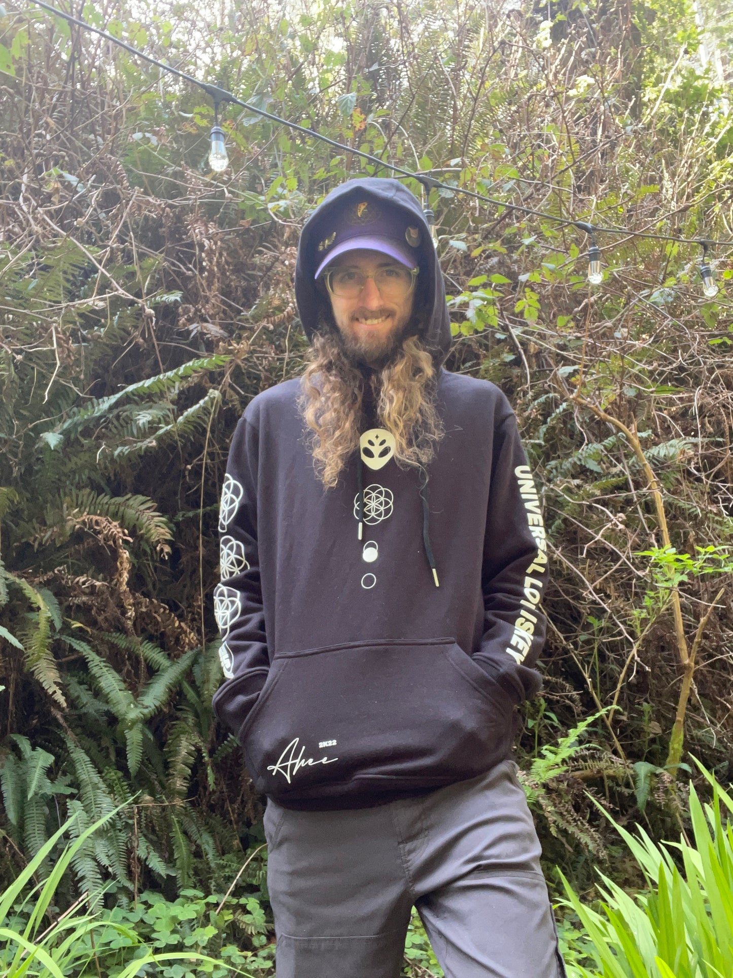 A black athletic hoodie from Drip Drop Labs featuring the "Universal Love is Key" design, casual fit, and front pouch pocket.