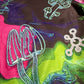 Drip Drop Labs Alien Mushrooms zip-up hoodie showing a colorful alien mushroom graphic on athletic black hoodie.