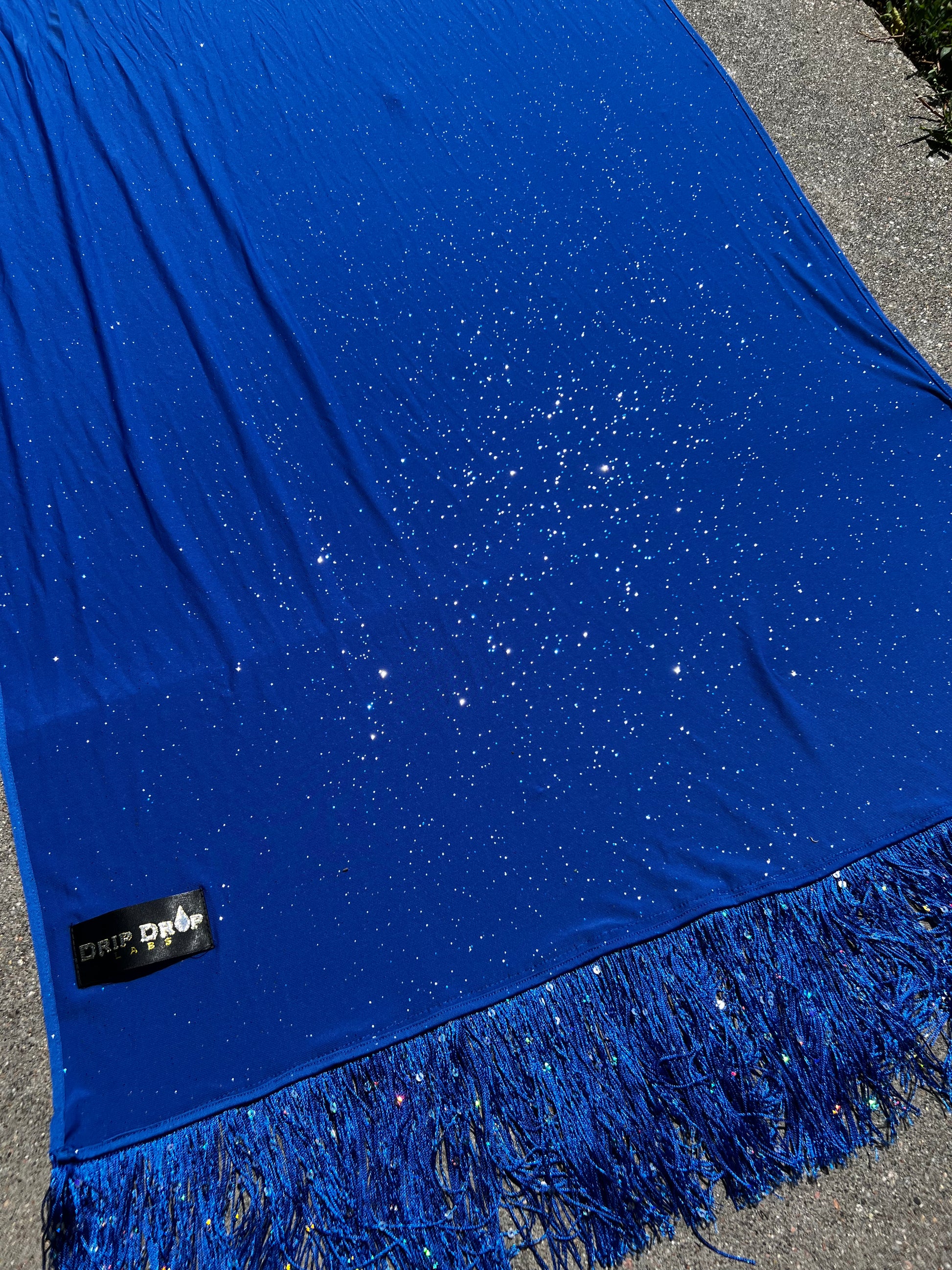 Blue Galactic Pashmina scarf by Drip Drop Labs featuring soft, luxurious fabric with a cosmic galaxy pattern.