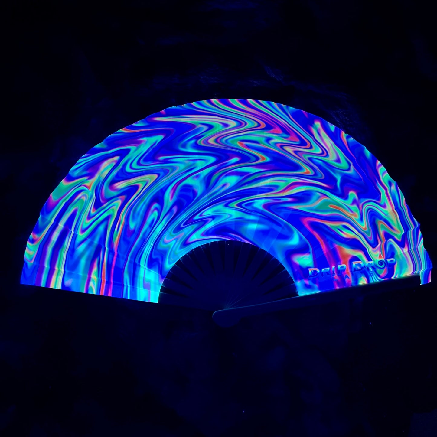 Candy Swirl Glow Fan by Drip Drop Labs featuring vibrant, colorful swirl design and glowing fan blades for a fun, eye-catching look.