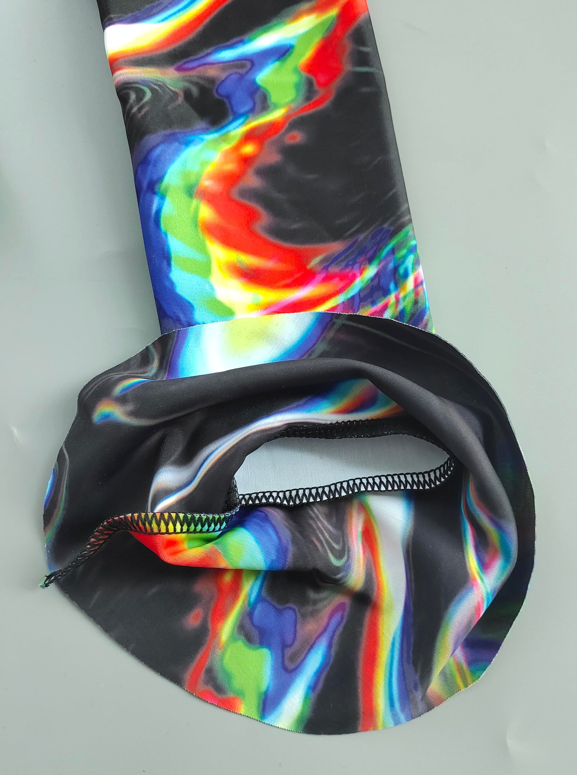 Drip Drop Labs Chromatic Seduction full-fit bathing suit with vibrant, colorful pattern and sleek design.