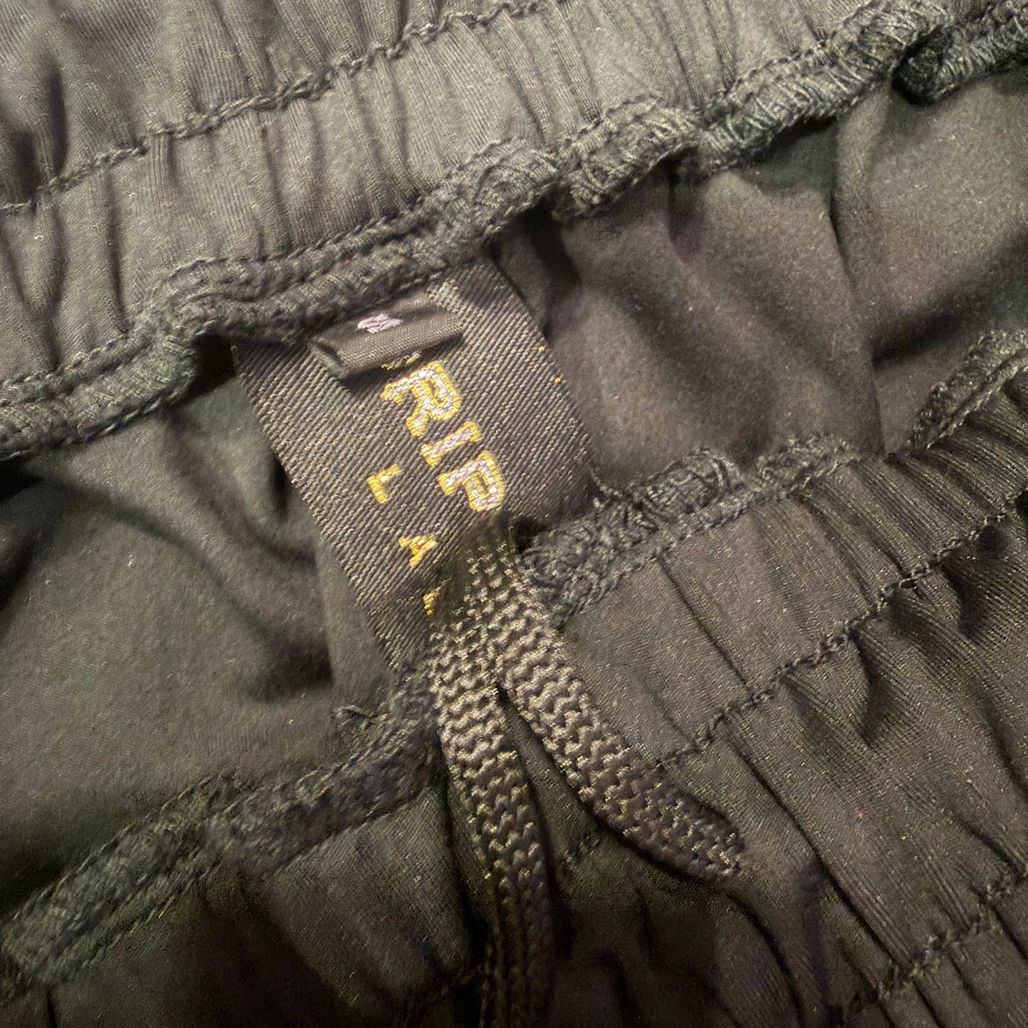 Drip Drop Labs DDL activewear joggers in black athletic joggers with a tapered fit and elastic waistband.
