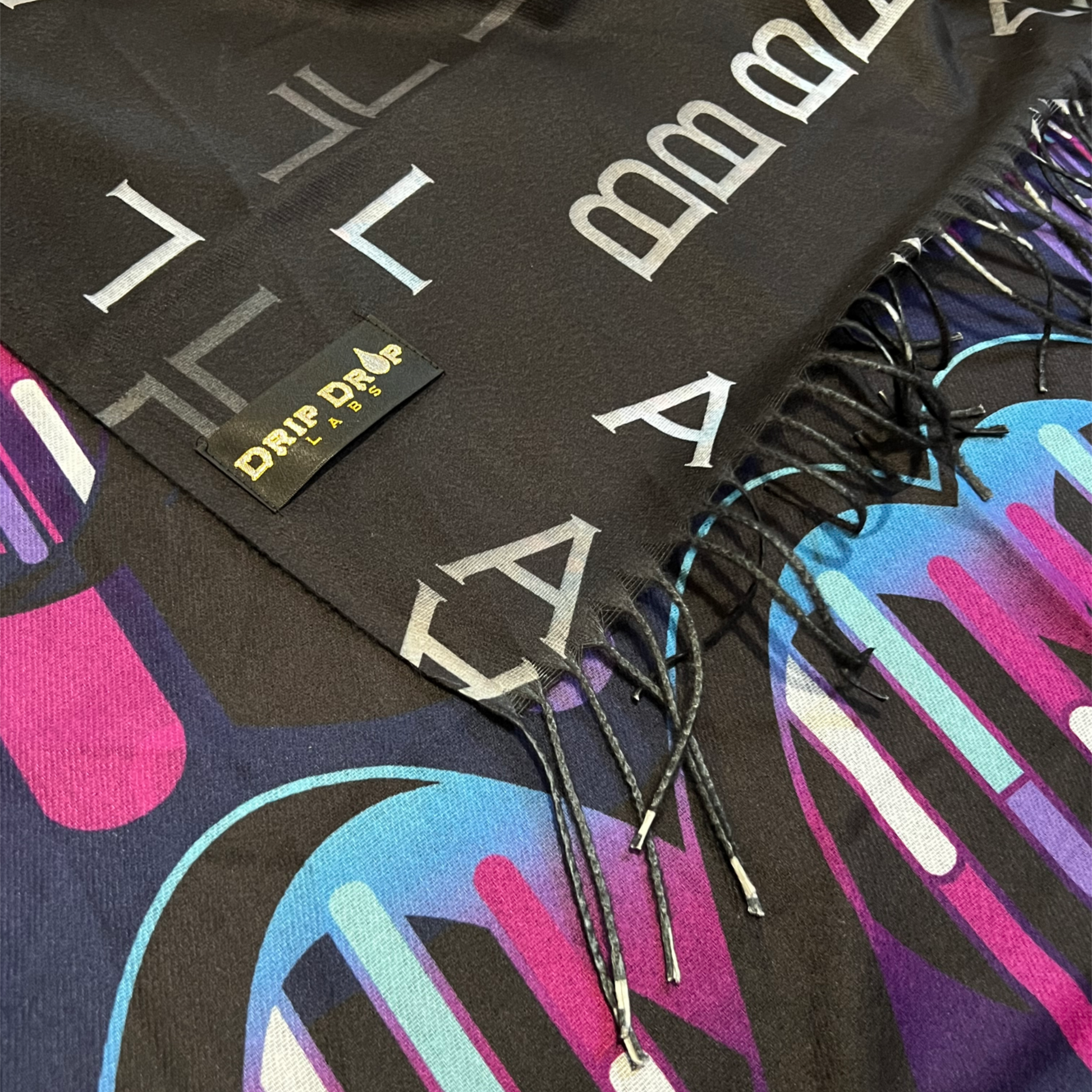 Drip Drop Labs DNA Labs Pashmina scarf in soft, luxurious fabric with intricate patterns and elegant drape.