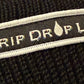 Drip Drop Labs beanie in black with embroidered logo, cozy knit fabric for warmth and casual style.
