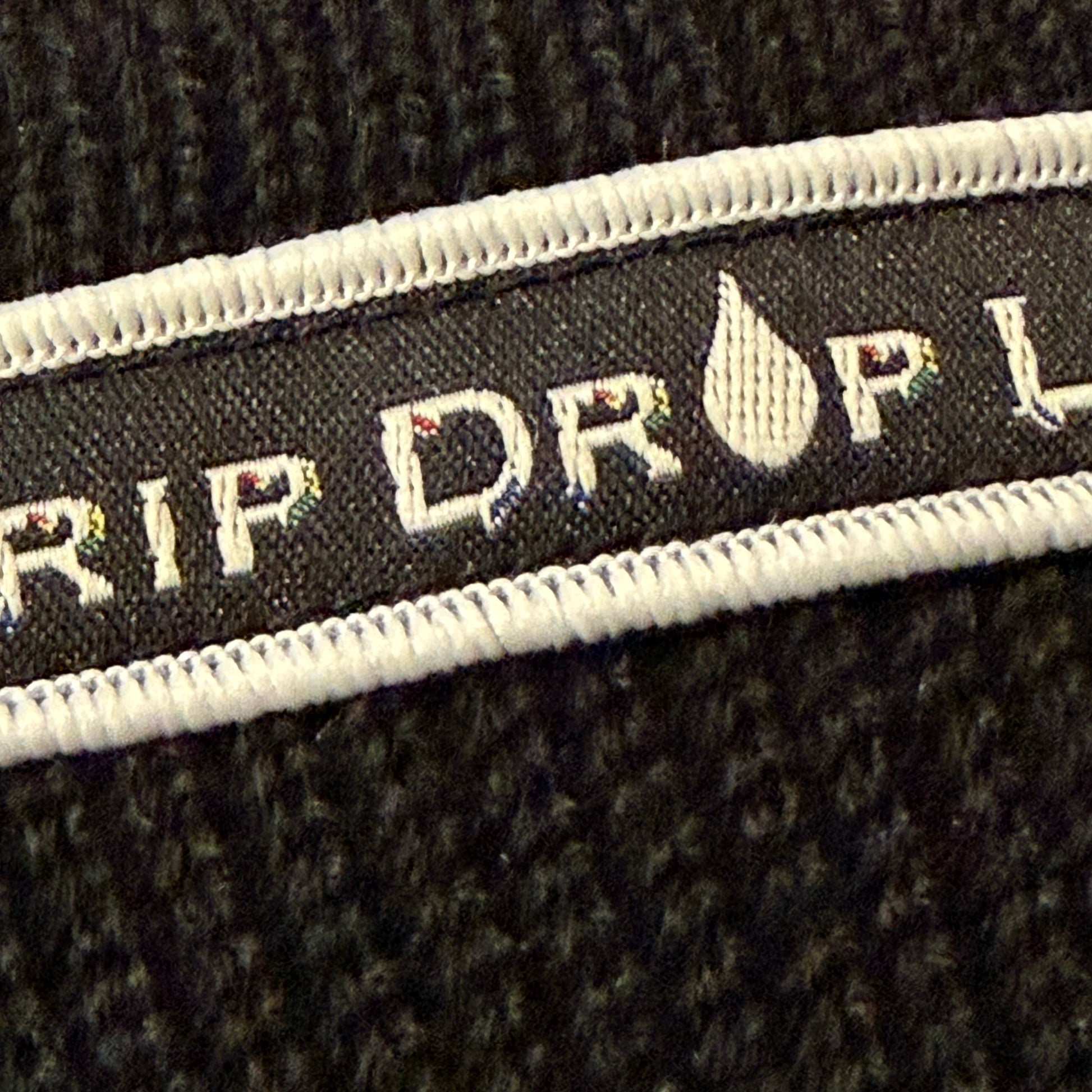Drip Drop Labs beanie in black with embroidered logo, cozy knit fabric for warmth and casual style.