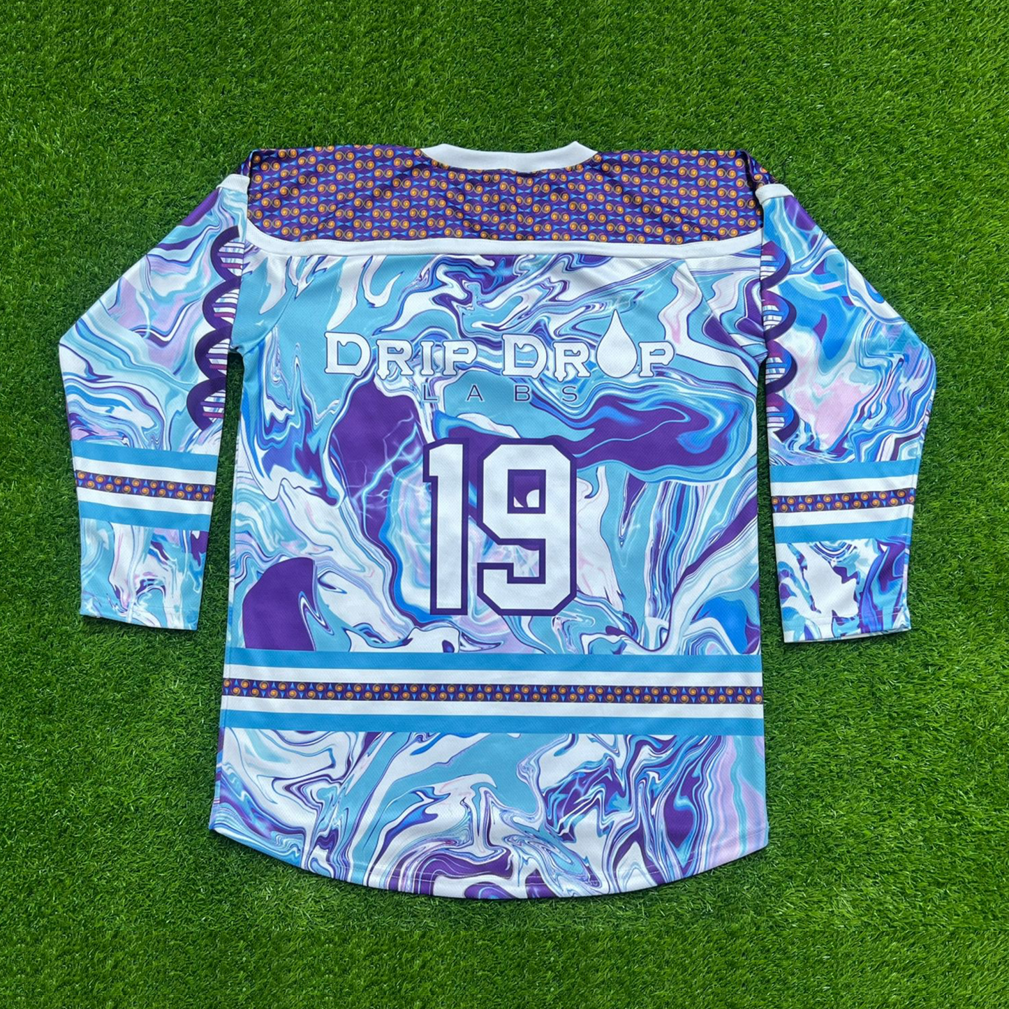 Drip Drop Labs Chill Drip Hockey Jersey featuring vibrant colors and bold design, made from breathable fabric.