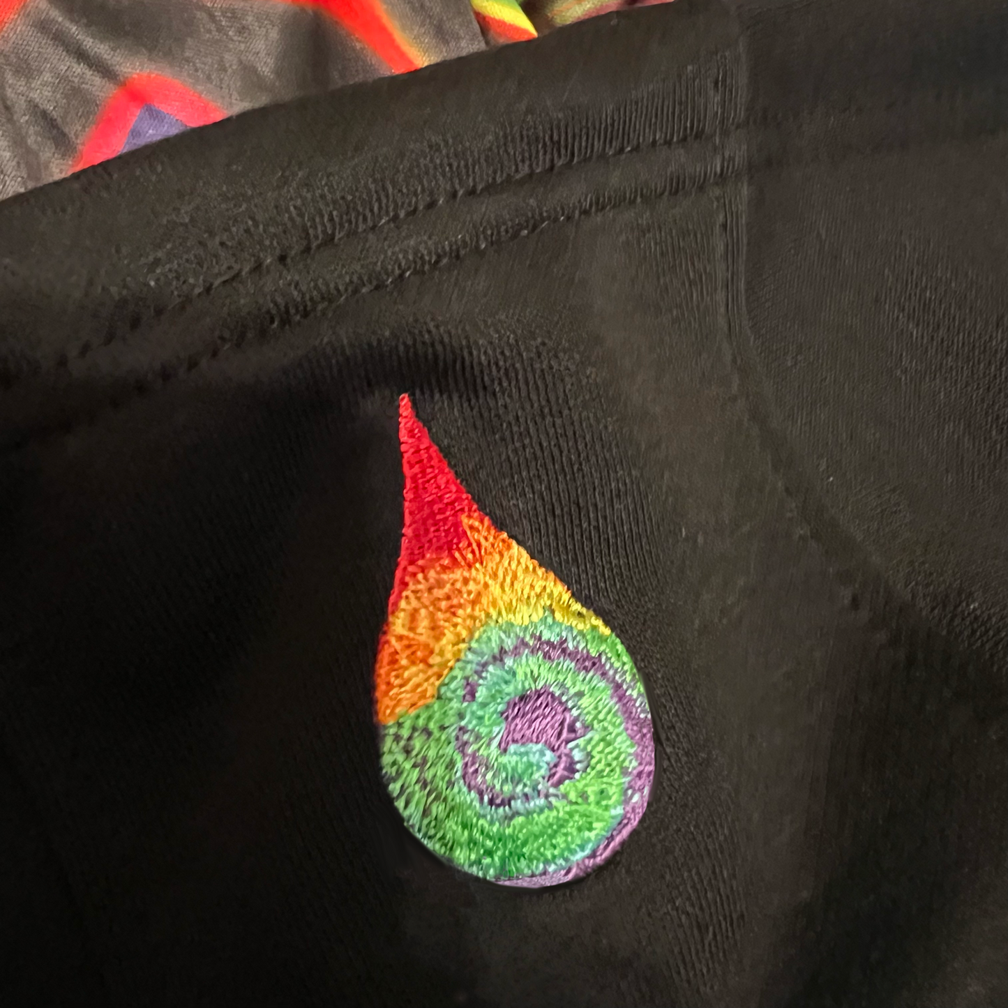 Drip Drop Labs embossed athletic hoodie with textured logo design, soft fabric, and adjustable drawstring hood.