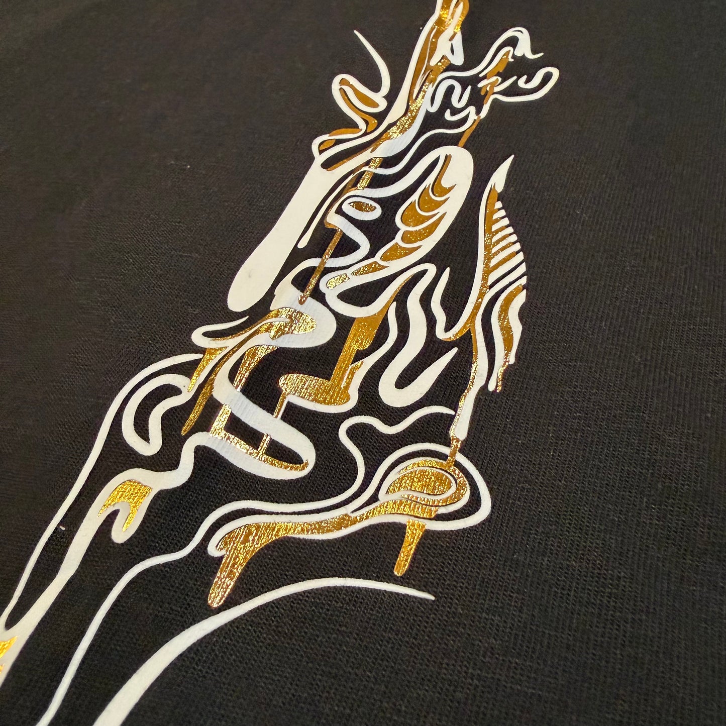 Golden Flow Tee from Drip Drop Labs, a stylish T-shirt with bold graphic design in bright gold and black colors.