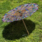 Drip Drop Labs OG Parasol open with detailed fabric canopy and wooden handle, showcasing a stylish parasol design.