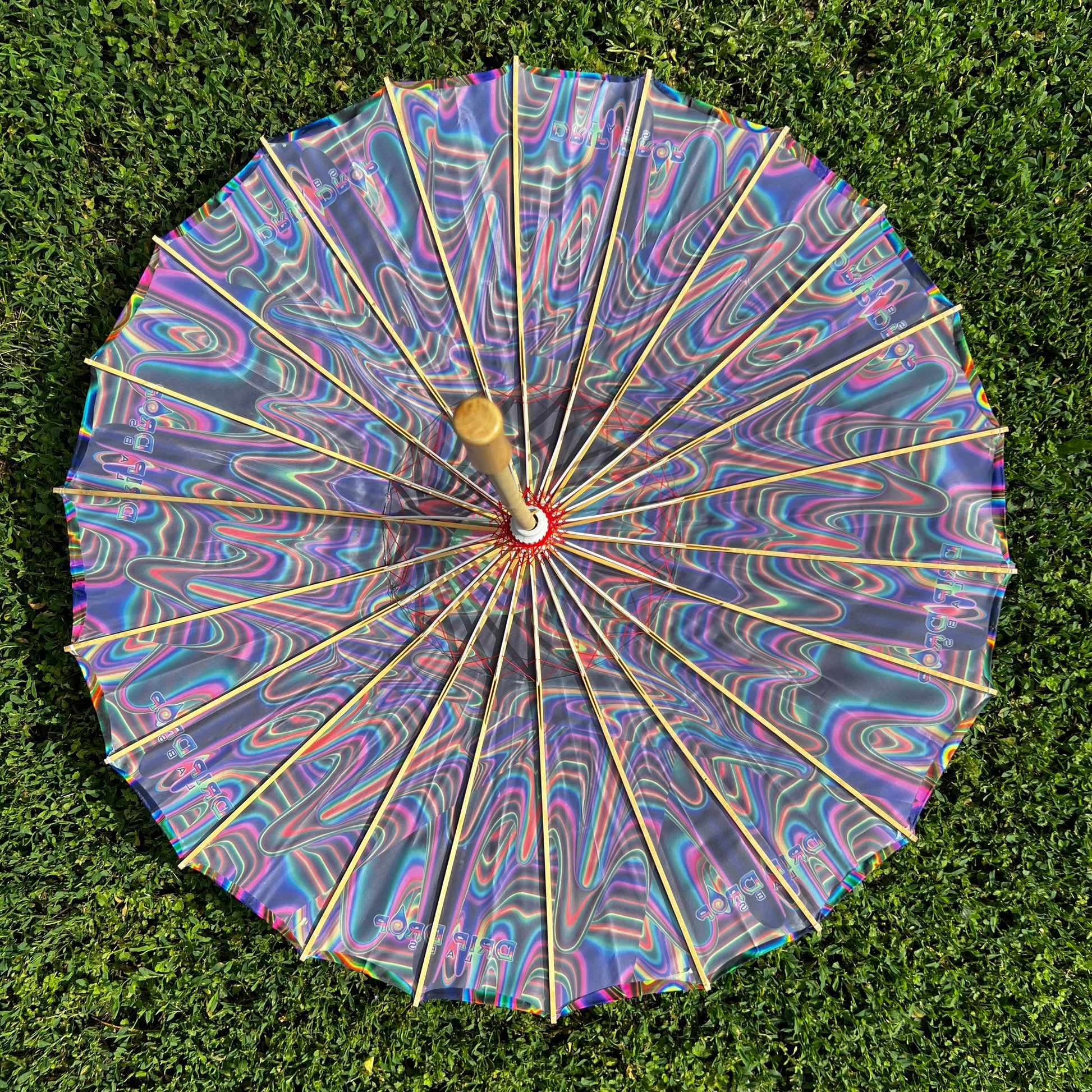 Drip Drop Labs OG Parasol, a stylish outdoor parasol with a modern design, providing shade and sun protection.