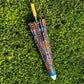 Drip Drop Labs OG Parasol open with black canopy and wooden handle, stylish outdoor parasol for sun protection.