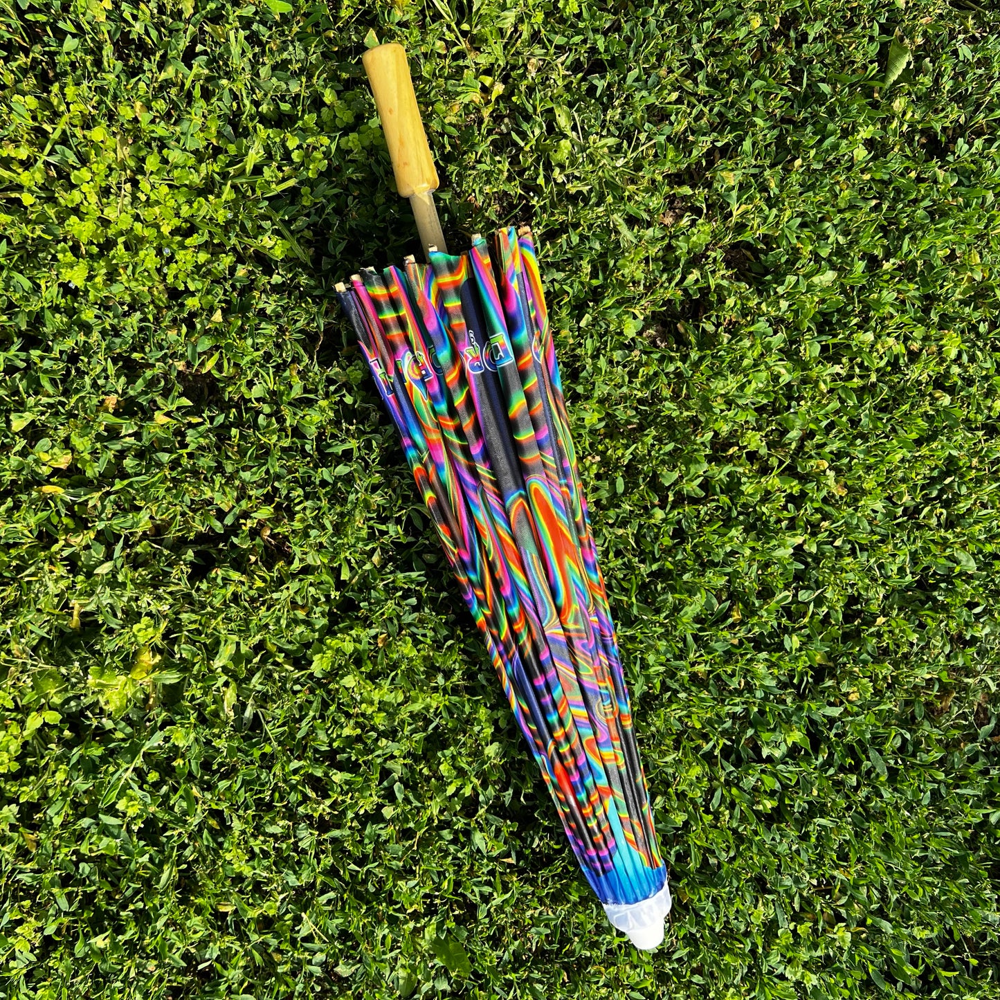 Drip Drop Labs OG Parasol open with black canopy and wooden handle, stylish outdoor parasol for sun protection.