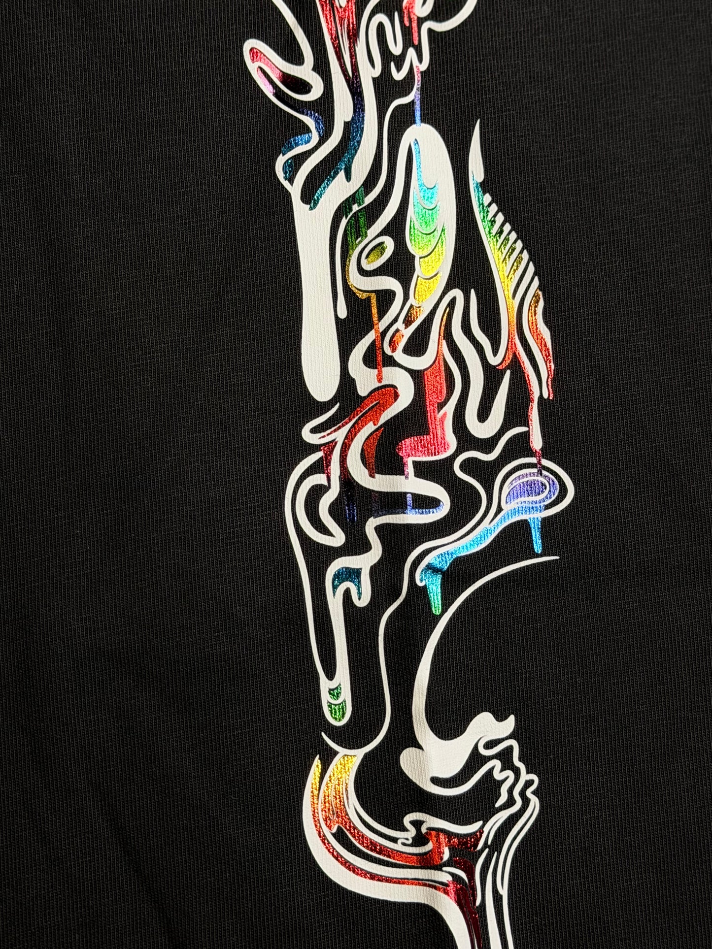 Drip Drop Labs Prism Flow Tee T-shirt featuring colorful geometric designs on a soft fabric backdrop.