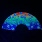 Drip Drop Labs Electric Flower Glow Fan displaying a colorful, illuminated flower-shaped fan with vibrant LED lights.