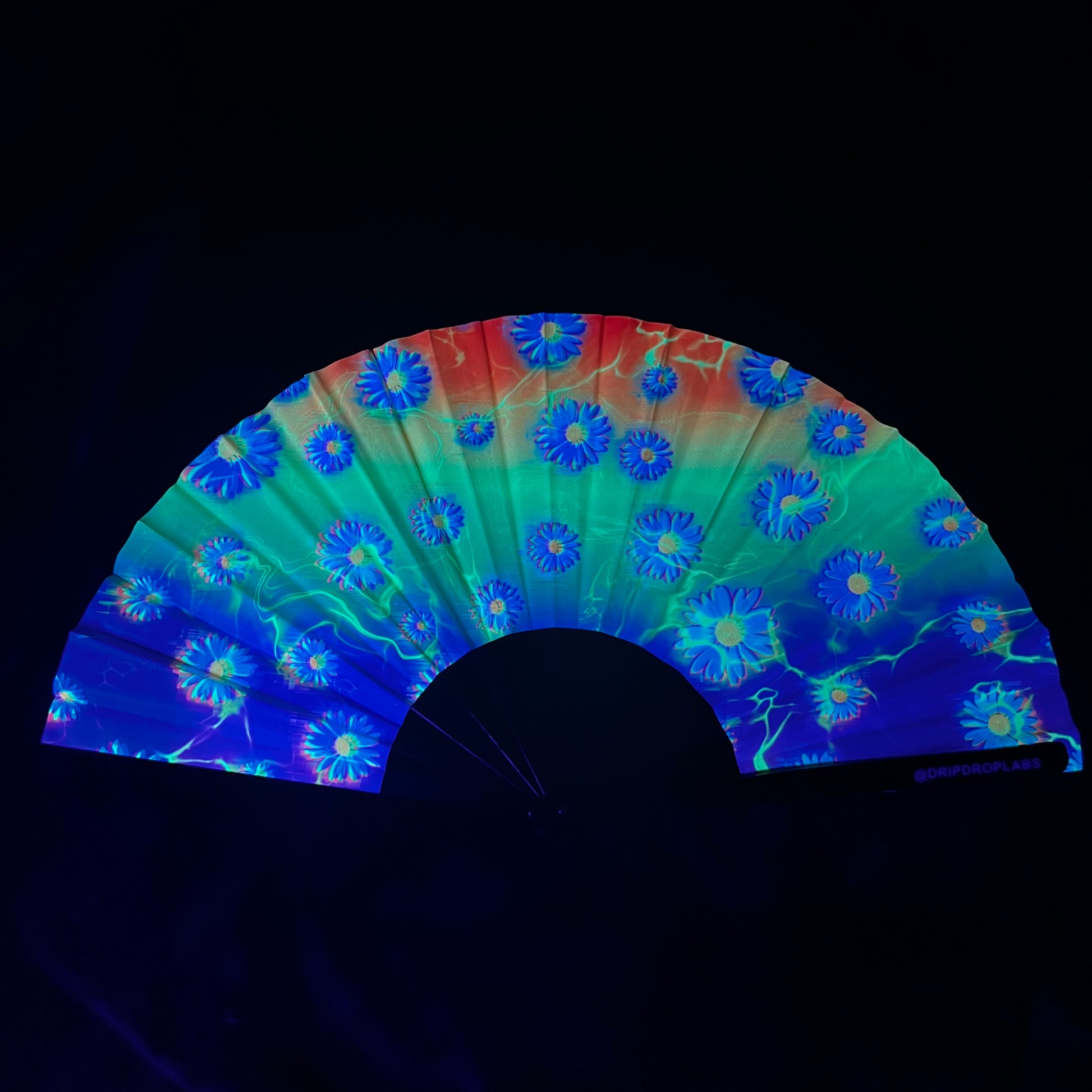 Drip Drop Labs Electric Flower Glow Fan displaying a colorful, illuminated flower-shaped fan with vibrant LED lights.