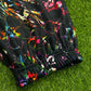 Limited edition Drip Drop Labs Frequency Bloom velvet parachute pants with vibrant floral design and relaxed fit.