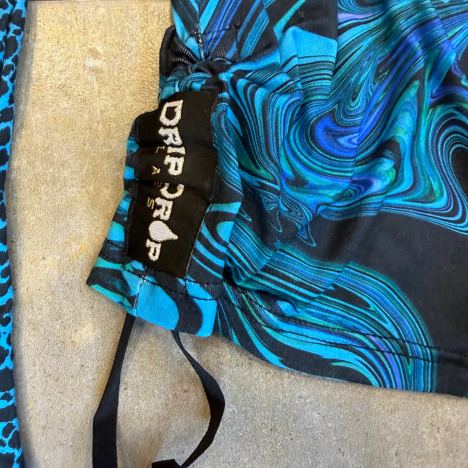 Drip Drop Labs Glitch Instinct hooded rave romper featuring a cyber animal design, vibrant colors, and festival-inspired style.