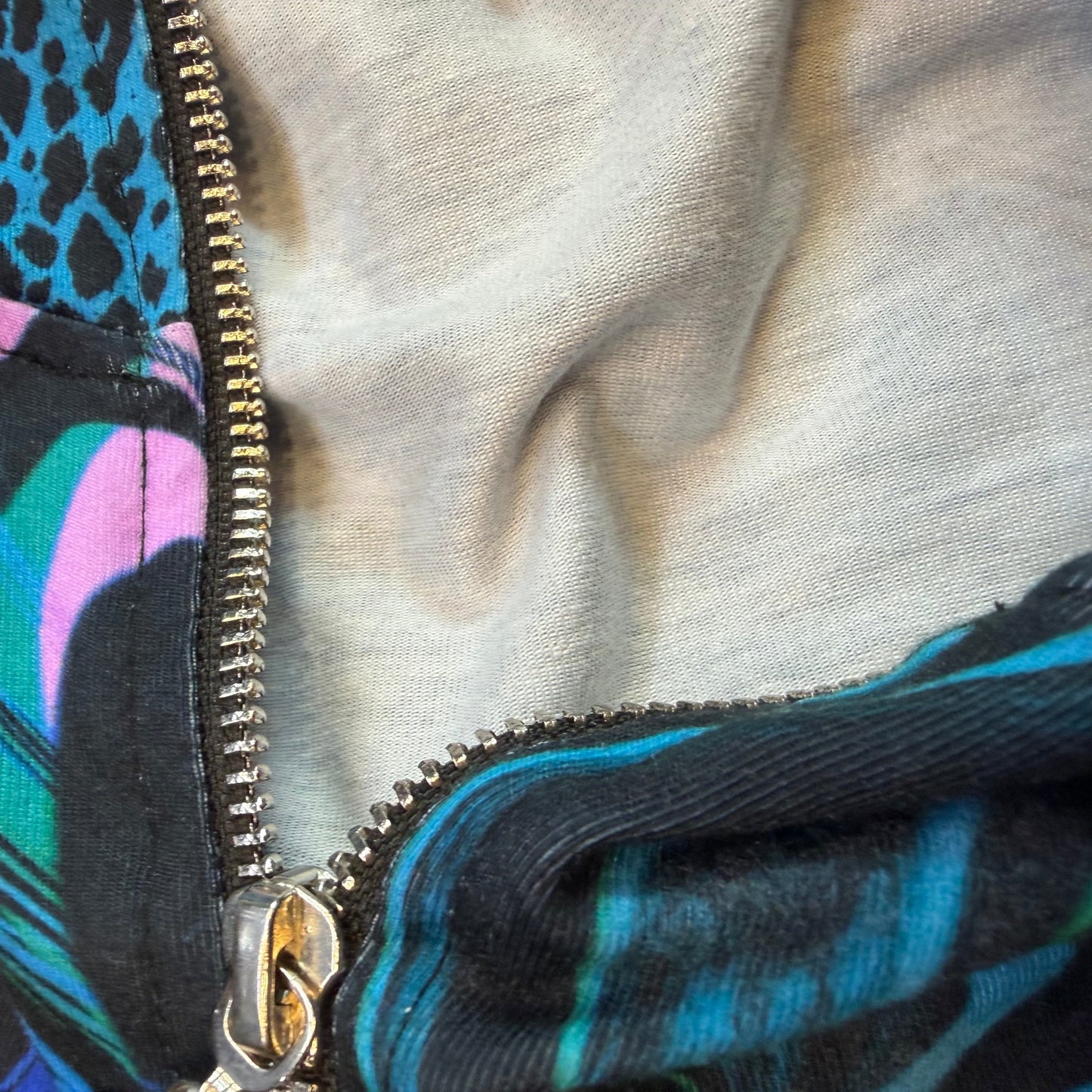 Drip Drop Labs Glitch Instinct hooded rave romper featuring cyber animal print, vibrant colors, and festival-ready design.