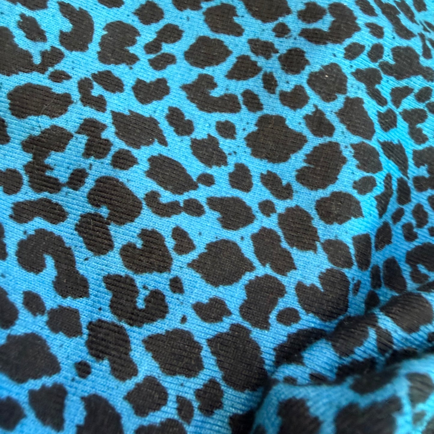 Drip Drop Labs Glitch Instinct hooded rave romper featuring cyber animal print, vibrant colors, and festival-ready style.