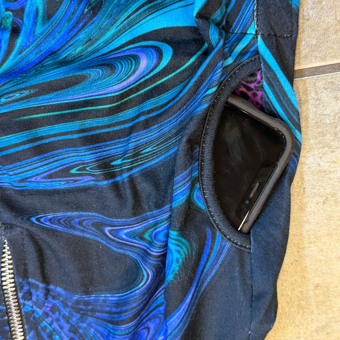 Drip Drop Labs Glitch Instinct hooded rave romper with cyber animal design, featuring vibrant colors and festival-ready style.