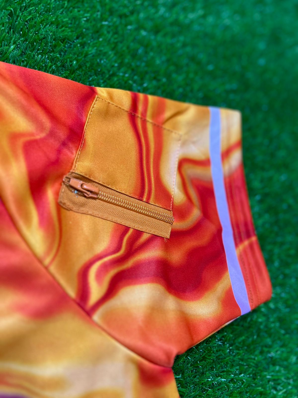 Drip Drop Labs GrizDrip Sunrise hooded baseball jersey with vibrant sunrise design and sporty style.