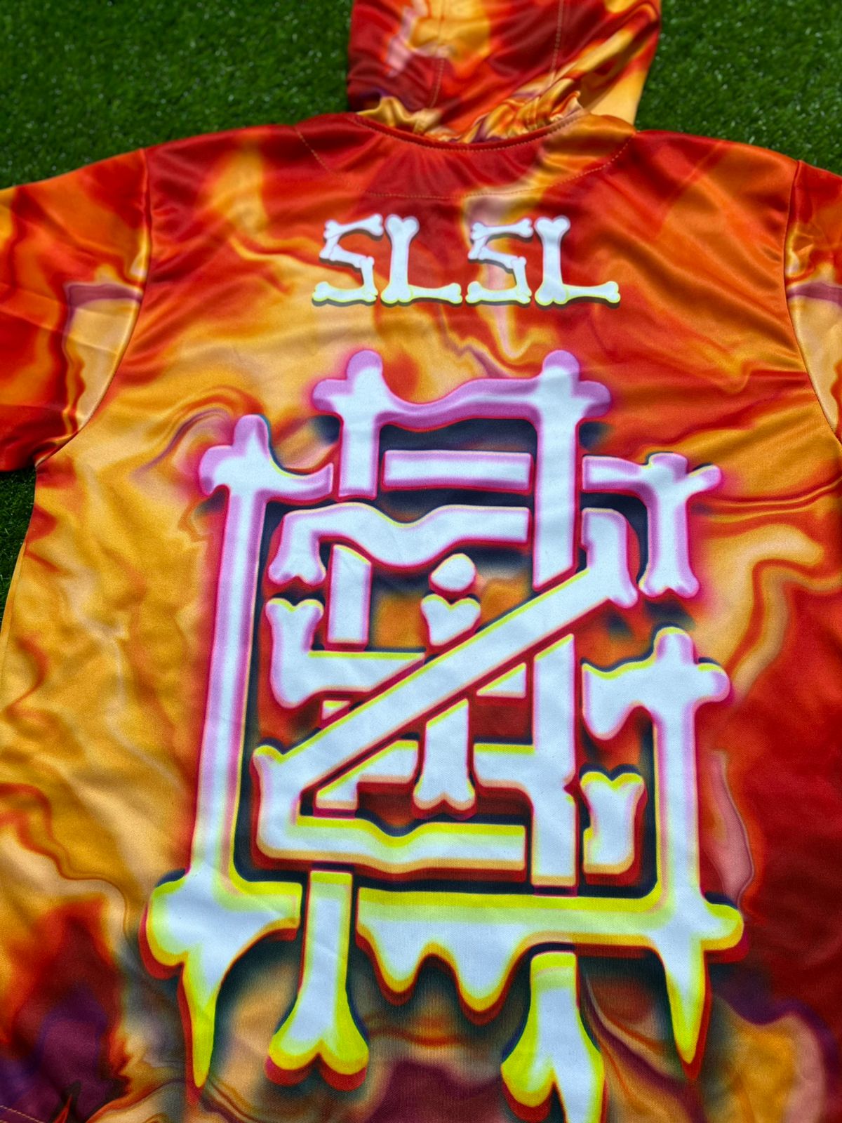 Drip Drop Labs GrizDrip Sunrise hooded baseball jersey with vibrant sunrise design, front logo, and contrasting sleeves.