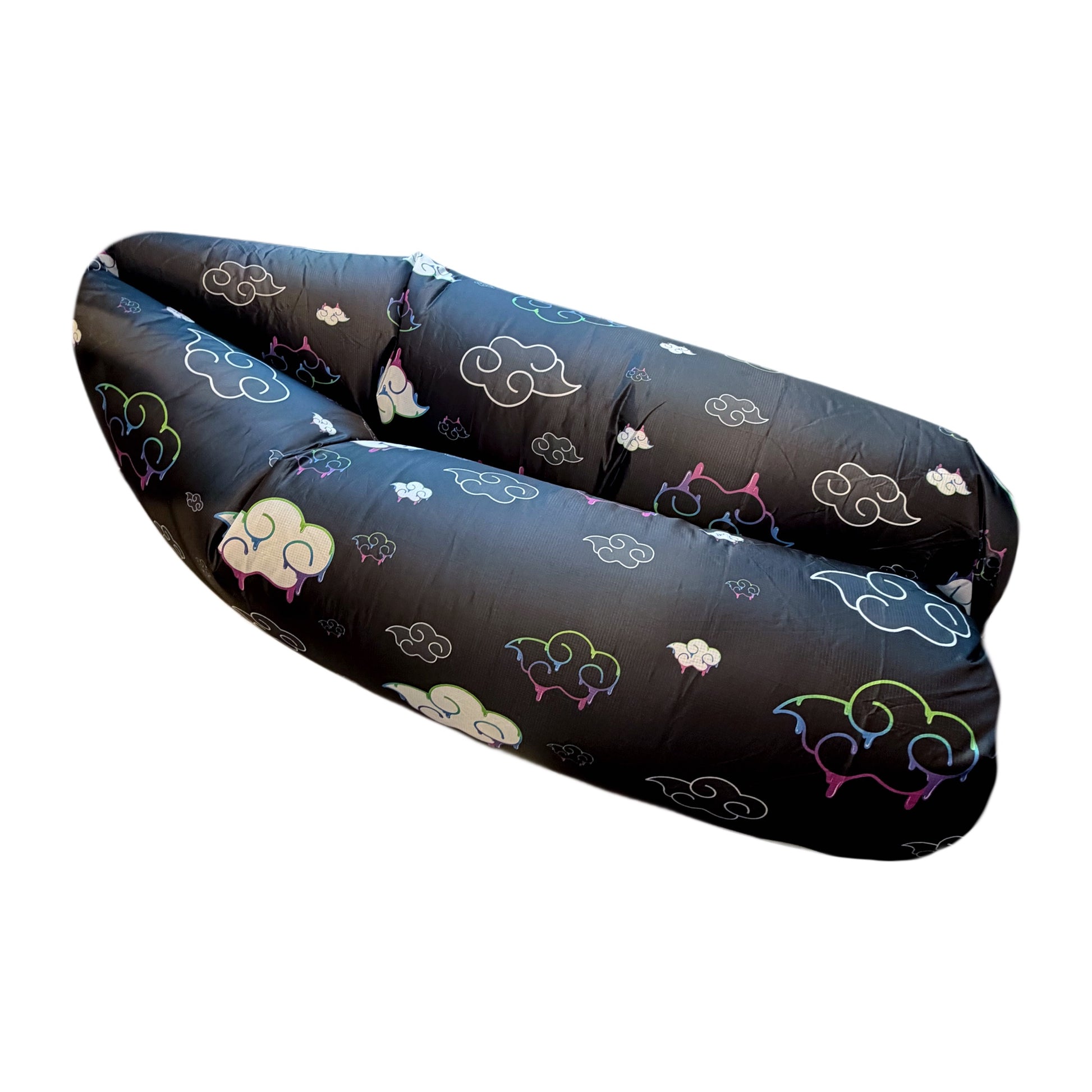 Juicy Couch inflatable sofa by Drip Drop Labs, perfect for camping and outdoor festivals, shown fully inflated on grass background.
