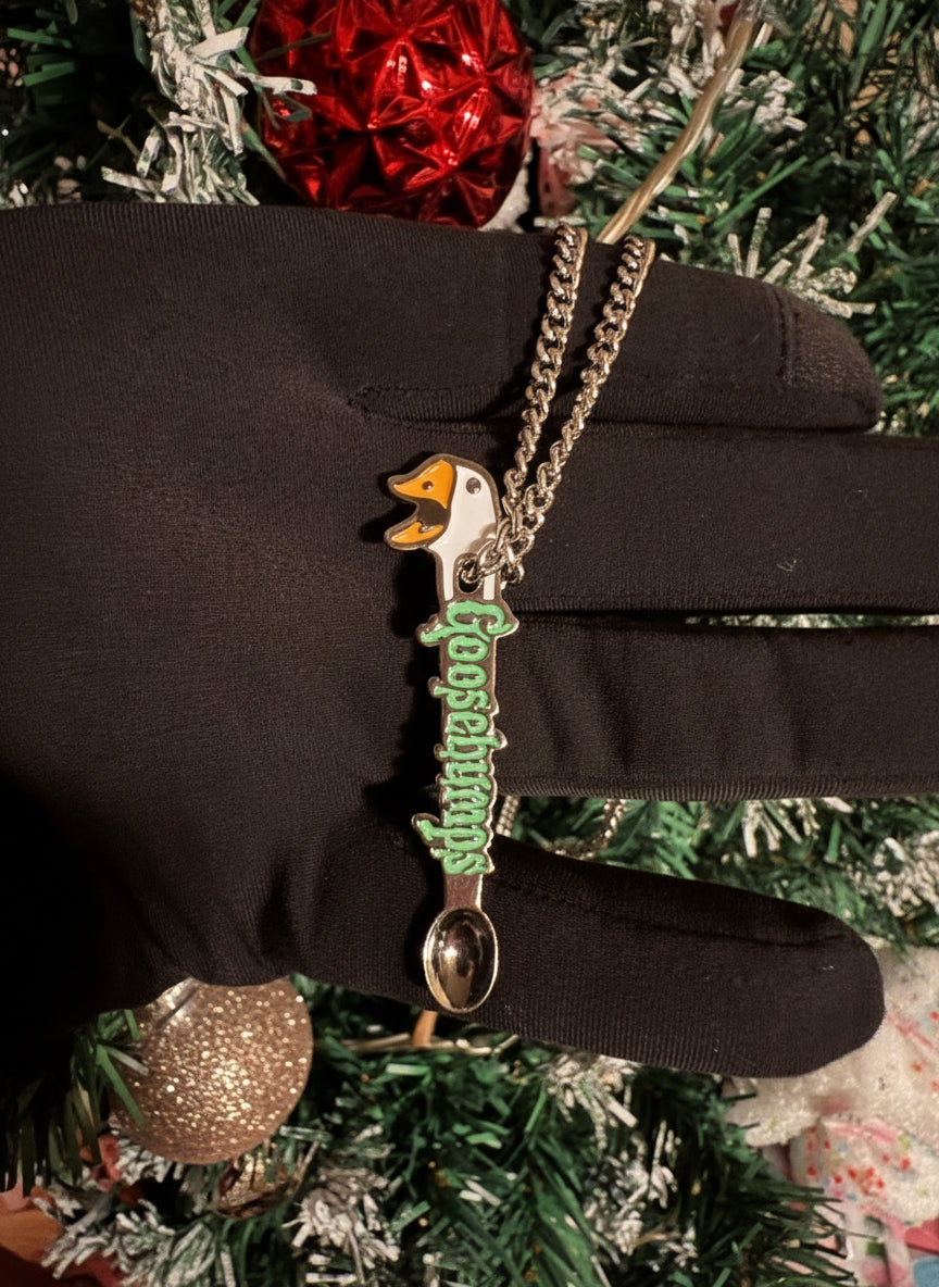 Drip Drop Labs Loose Goose Spoon pins featuring a colorful goose design on a metal pin backing.