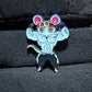 Muscle Muscle Mice enamel pin by Drip Drop Labs featuring a detailed, colorful mouse design on a metal pin backing.