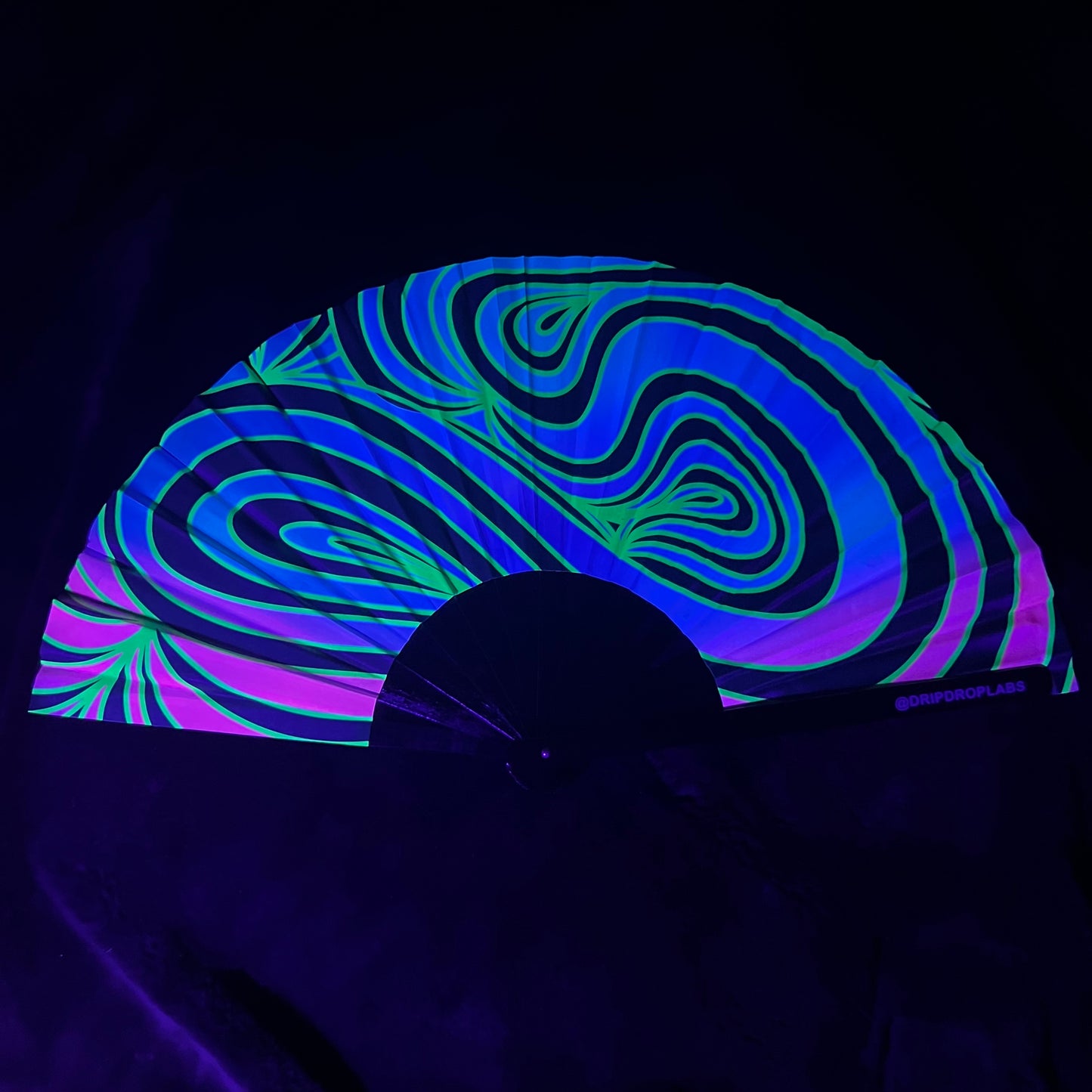 Drip Drop Labs Neon Waves Glow Fan with vibrant neon design, handheld fan for cooling and visual effect.
