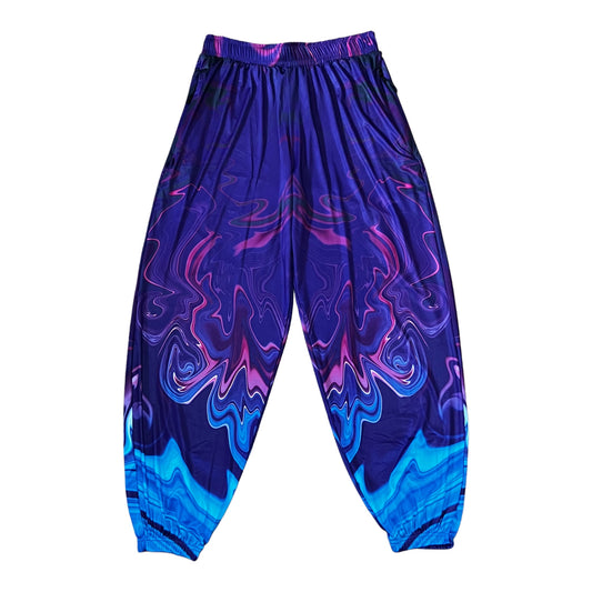 Bright neon waves pattern on Drip Drop Labs parachute pants with a relaxed fit and adjustable waistband.
