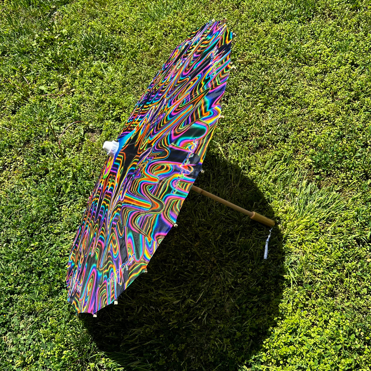 Drip Drop Labs OG Parasol with colorful patterned canopy and sturdy handle, designed for stylish sun protection.